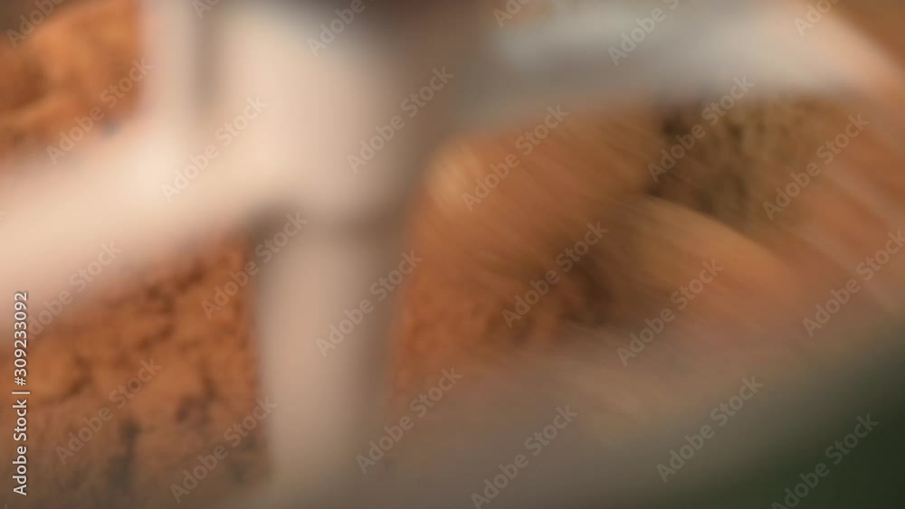 Process of making cookie, mixing butter and brown sugar in mixing machine. Process of making cookie, mixing butter and brown sugar in mixing machine.