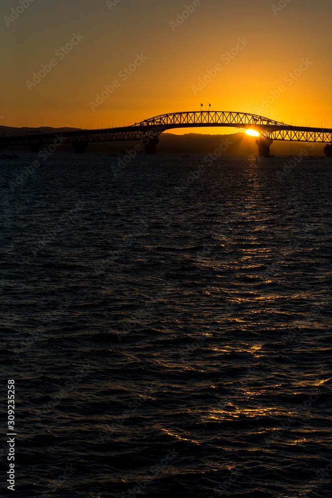 Fototapeta premium Auckland Harbour Bridge at sunset vertical.