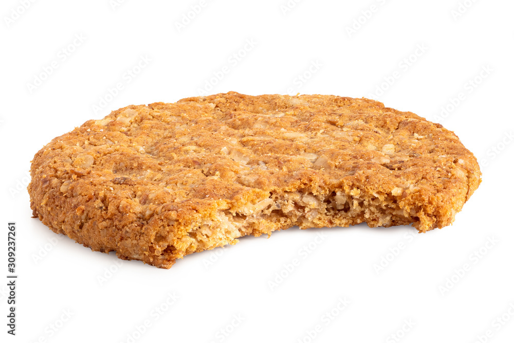 Crunchy oat and wholemeal biscuit isolated on white. Missing bite. Crunchy oat and wholemeal biscuit isolated on white. Missing bite.