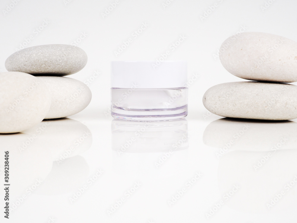 on a white background near Zen stones, water drops. Freshness and beauty. on a white background near Zen stones, water drops. Freshness and beauty.