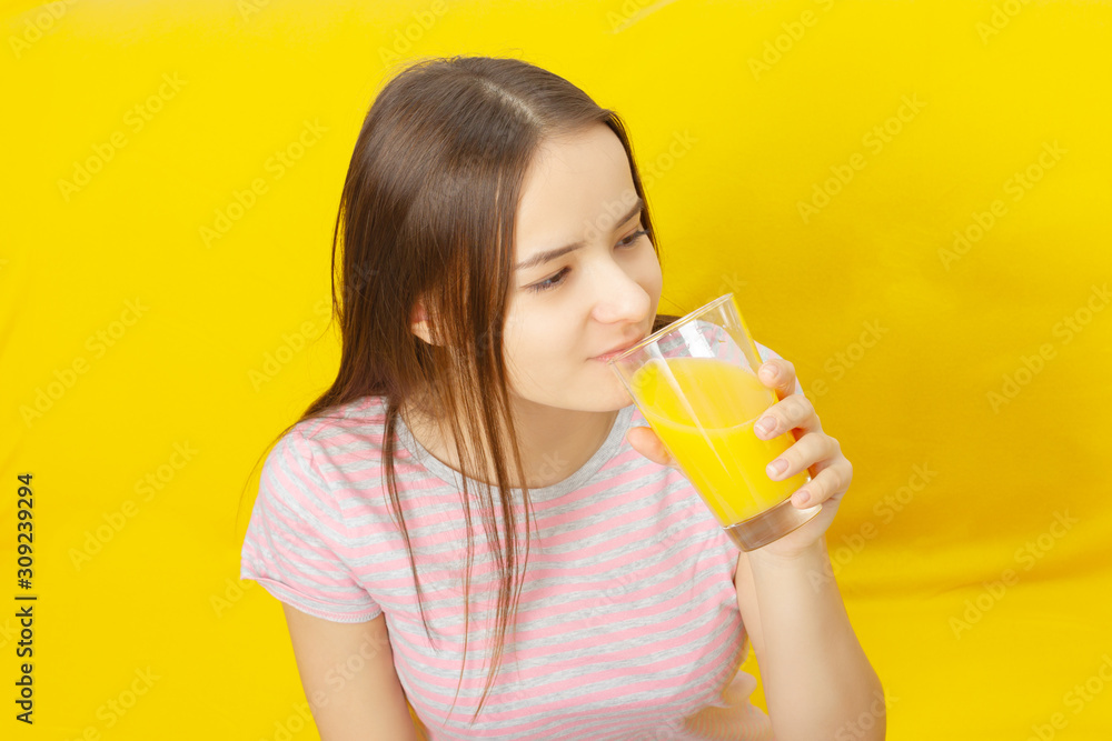 Girl drinks orange juice