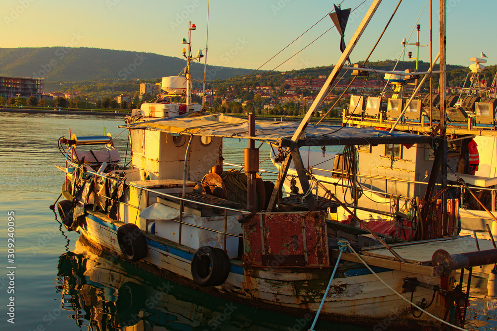 Close up of the moored old fishing boat in harbor of Koper