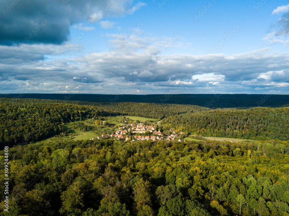 Aerial view of the ancient Monastery Bebenhausen, a place of interest close to the city Tuebingen in Germany, during a sunny autumn day.