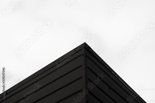 Black Corrugated metal sheet texture surface of the wall. Galvanize steel background.