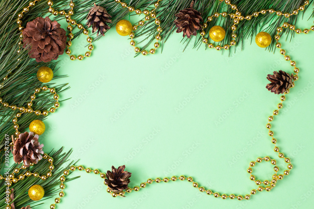 Christmas background with fir on green background. Flat lay. Mockup.