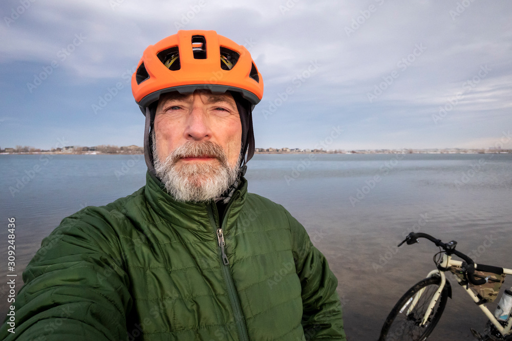 senior male dressed for winter biking senior male dressed for winter biking
