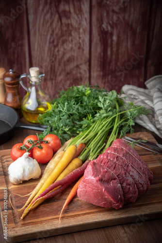 tied top round beef for roast beef with vegetable