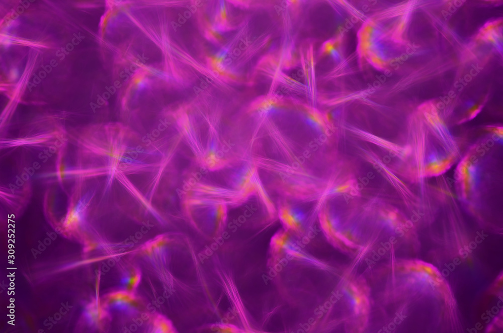 Flickering abstract background with defocused purple light