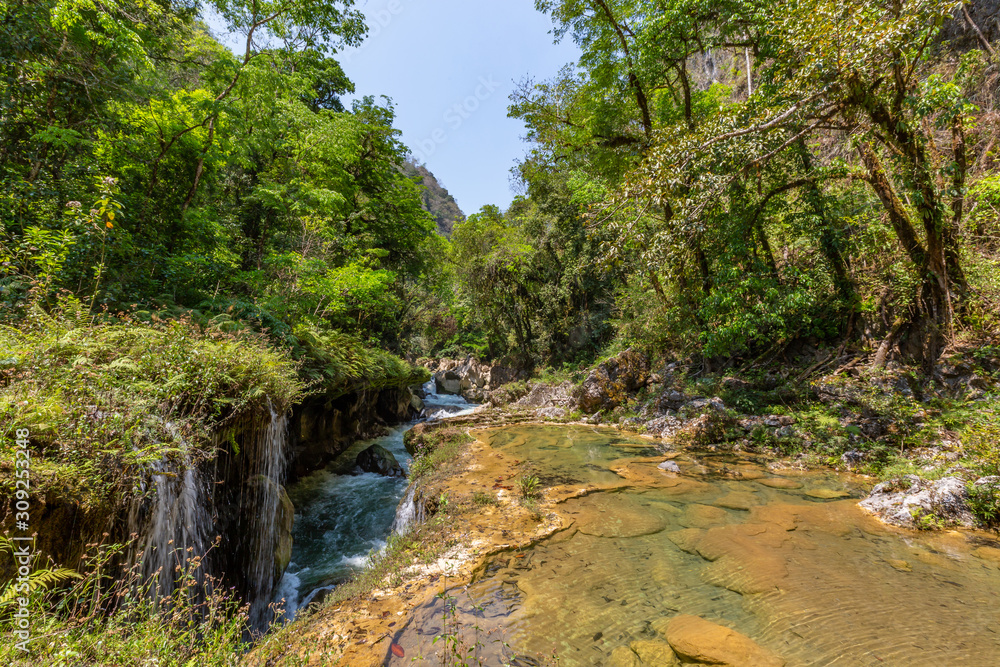 Panorama of the limestone ridge with cascades and waterfalls of Semuc Champey in the Peten jungle and rainforest of Guatemala. Panorama of the limestone ridge with cascades and waterfalls of Semuc Champey in the Peten jungle and rainforest of Guatemala.