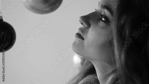 young woman blowing soap bubbles