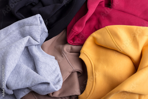 Concept colorful warm blank sweatshirts closeup