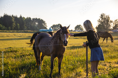 Girl and horse in the field