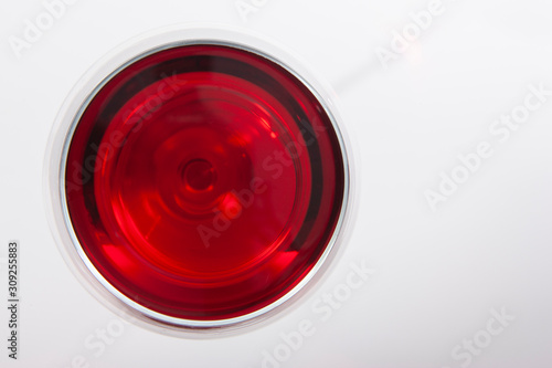 Glass of red wine with shadow.Top view