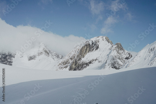 Snow White Glacier Mountains with Brilliant Blue Sky © Jon