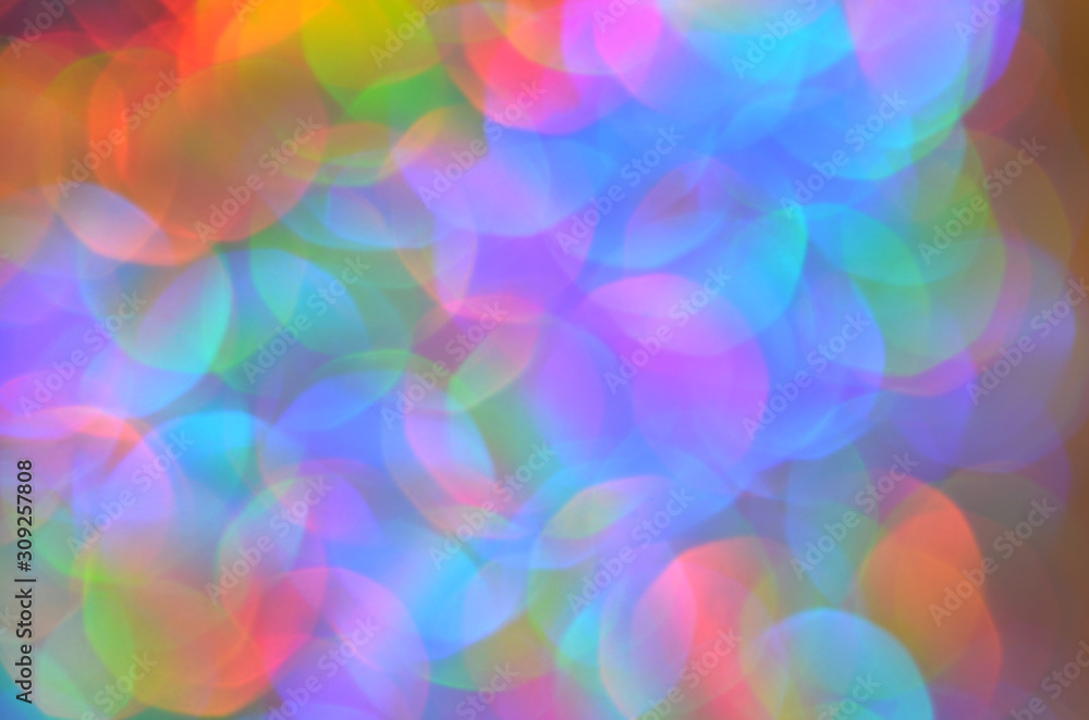 Shiny abstract background with festive defocused lights, colorful bokeh. Christmas or New Year holiday concept. Shiny abstract background with festive defocused lights, colorful bokeh. Christmas or New Year holiday concept.