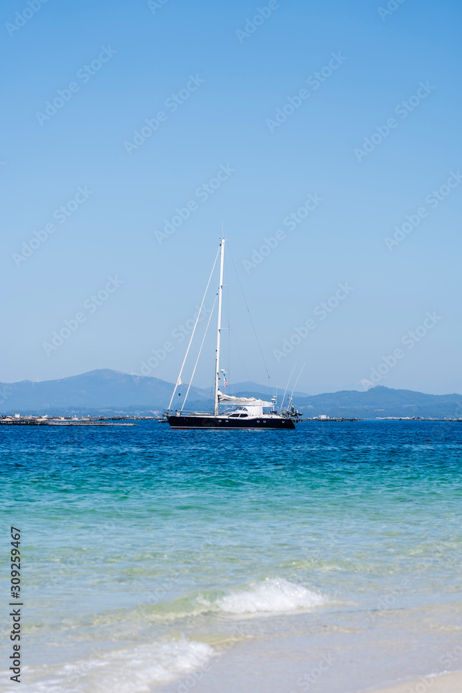 A sailboat near a beach