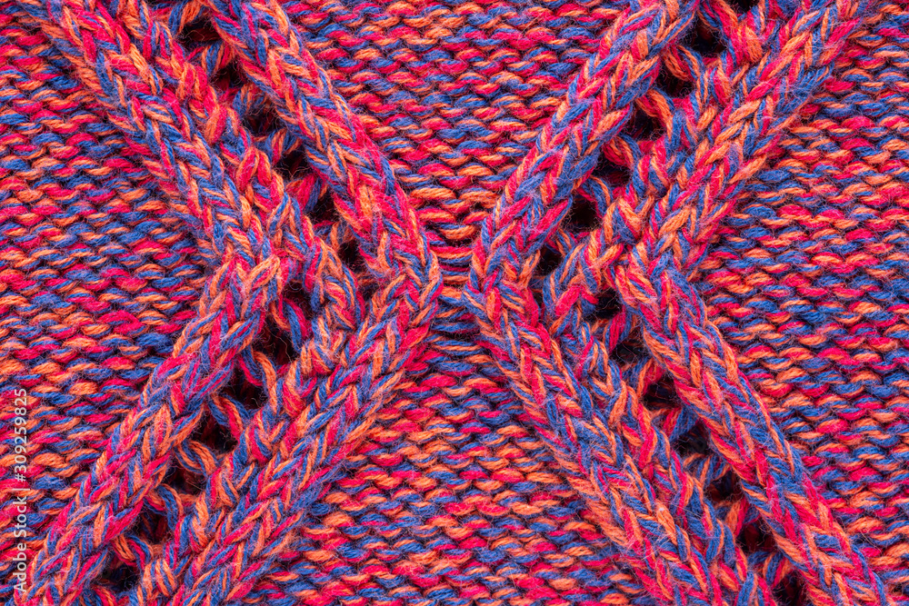 Knitted sweater texture. Pink melange rhombus pattern. Background. Copy space
