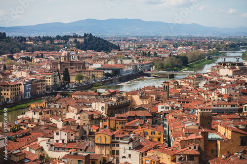 Beautiful super wide-angle aerial view of Florence, Italy with Florence Cathedral di Santa Maria del Fiore, mountains, skyline and scenery beyond the city, seen from the tower of Palazzo Vecchio © tsuguliev