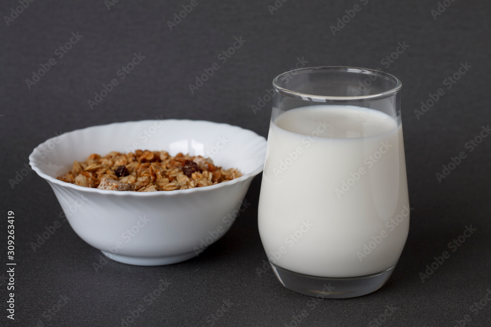 healthy Breakfast: a glass of milk and a Cup of muesli healthy Breakfast: a glass of milk and a Cup of muesli