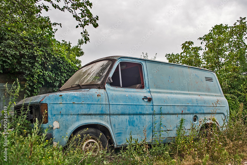Old truck in the forest. A rusty pickup car. Rusty abandoned old car Old truck in the forest. A rusty pickup car. Rusty abandoned old car