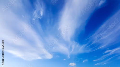 Sticker High white wispy cirrus clouds with cirri-stratus in the blue sky