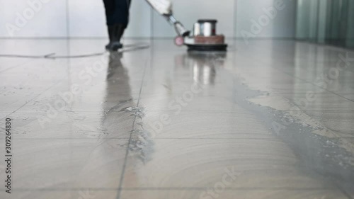 Labor cleaning the floor with cleaning machine - Slow motion	