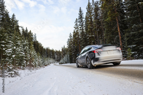 Electric car driving, mountains snow © Sergei Belski