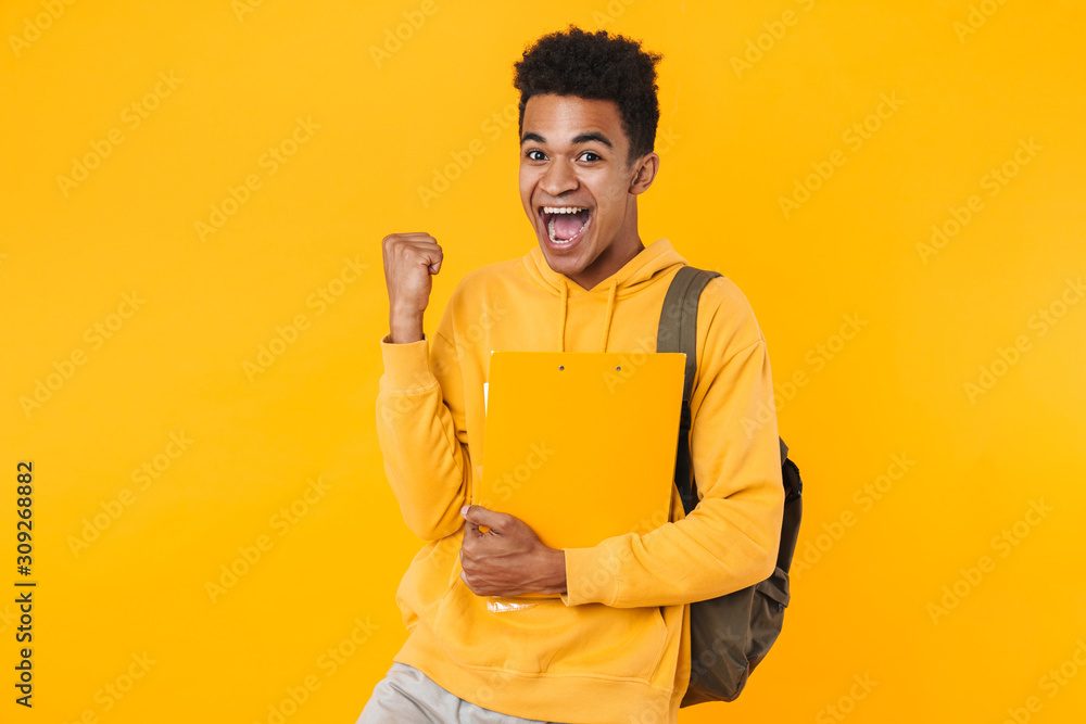 Portrait of a happy young african teenager boy standing