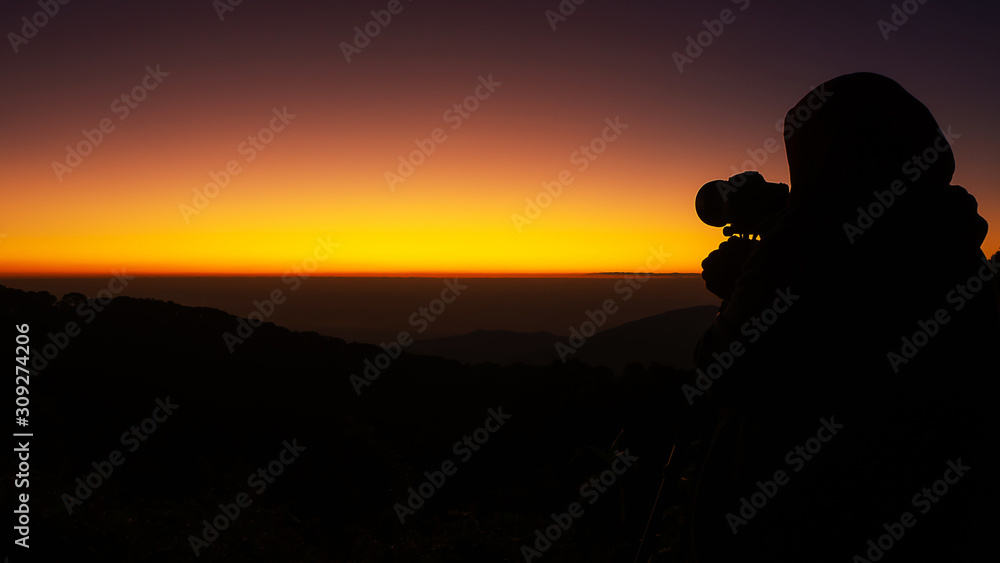 The silhouette of the photographer in the morning