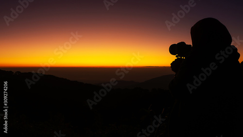 The silhouette of the photographer in the morning