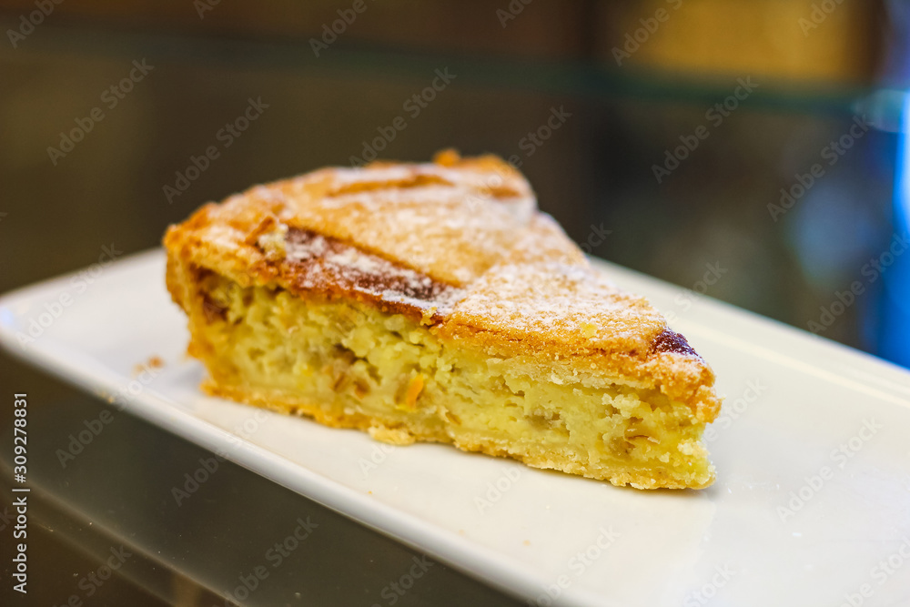 slice of pastiera, typical Neapolitan Easter cake, from Italian pastry
