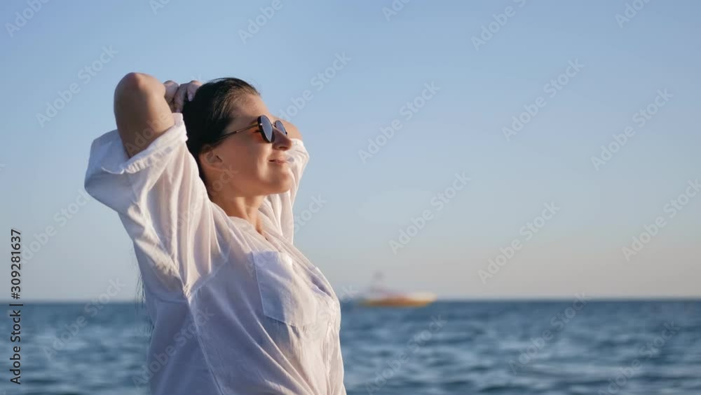 Attractive laughing trendy female enjoy sunbathing having positive emotion Attractive laughing trendy female enjoy sunbathing having positive emotion