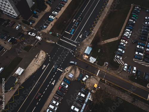 A lot of cars in the parking lot. Colorful moody drone shoot.