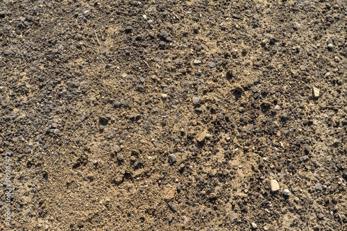 High angle shot of a deserted rocky stone texture of the soil photo