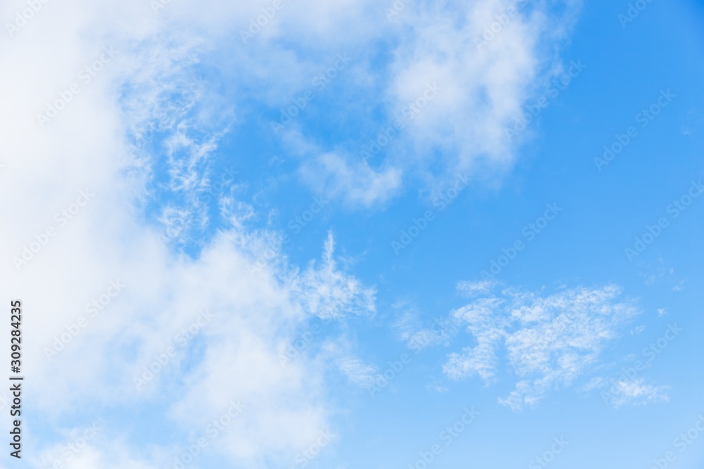 Obraz premium Light blue sky with cirrocumulus clouds. Beautiful sky background