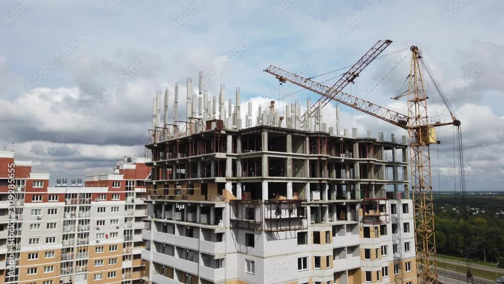 construction of a multi-storey residential building, two cranes work construction of a multi-storey residential building, two cranes work