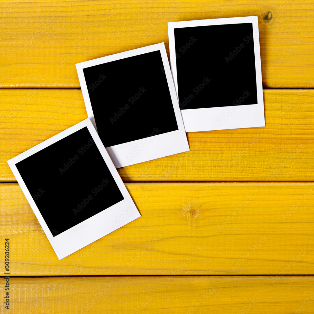 Blank photo prints on a table Blank photo prints on a table