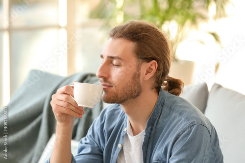 Handsome man drinking coffe...