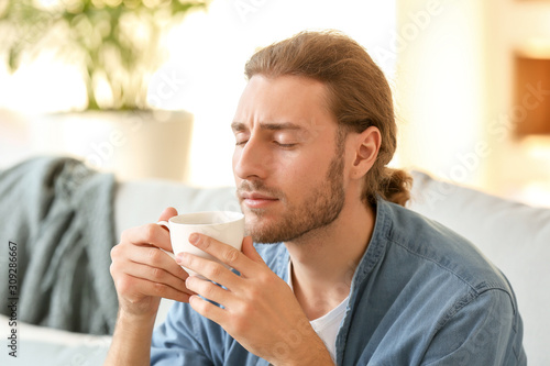 Handsome man drinking coffe...