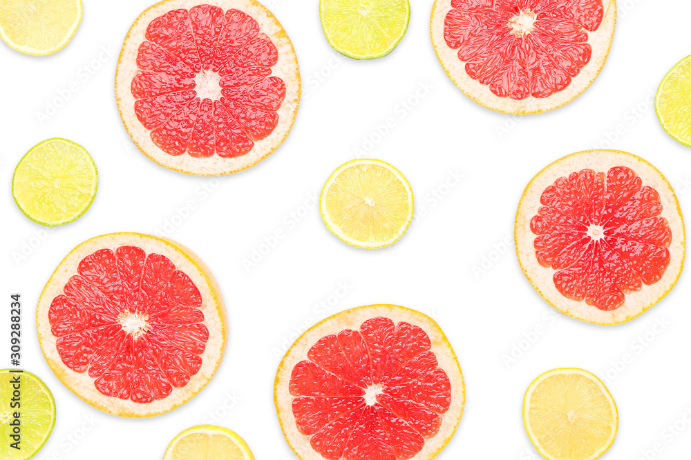 Fresh cut grapefruit, lemon and lime on white background