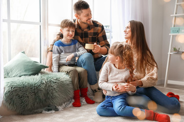 Happy family resting at home