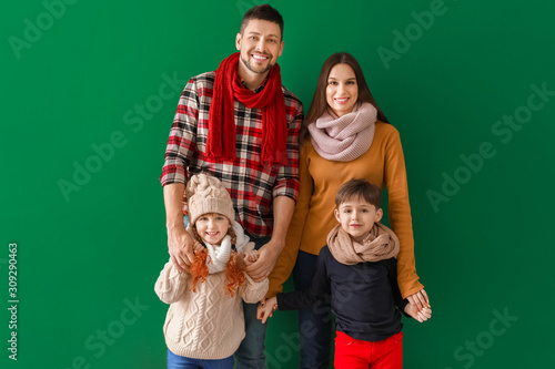 Happy family in winter clot...