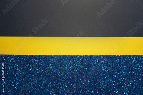 Color yellow and blue papers background with glitter