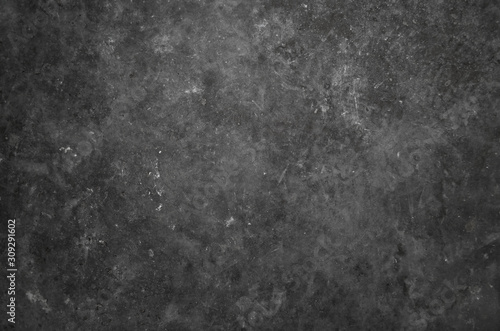 Dark rough texture of an untreated concrete wall