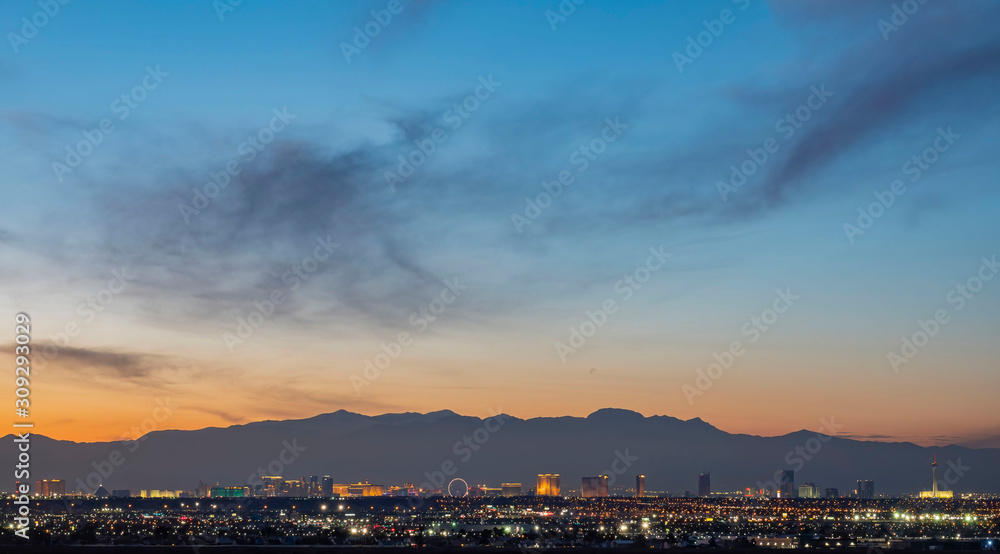Sunset aerial view of the strip with mountain behind