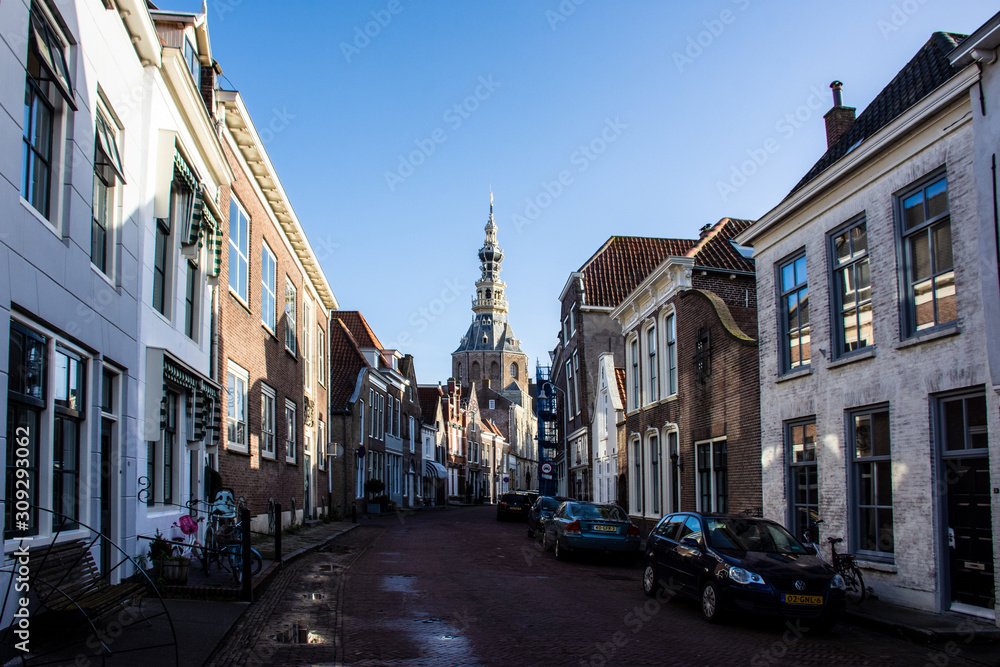 Zierikzee, Netherlands - December 6, 2019 - View on old Dutch houses and tower of City Museum in Zierikzee, historical town in province Zeeland, Netherlands