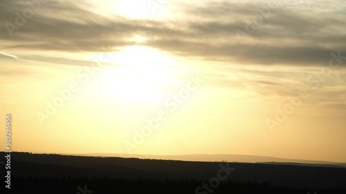 Zoom out of a beautiful sunrise over the mountains
