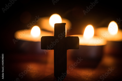 Candles and wooden cross