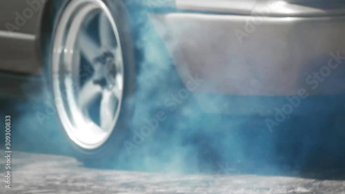 slow motion race drift car burning tires on speed track photo