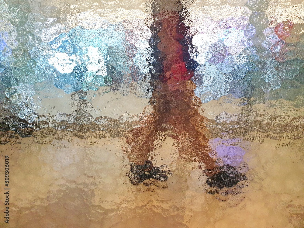 Fototapeta premium Person behind glass.Shadow abstract background.Rough surface and not clear.Textured design on mirror glass